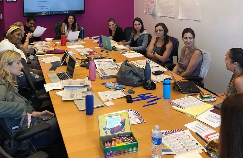 Image: Representatives from WMN meet to put together the voter guide.