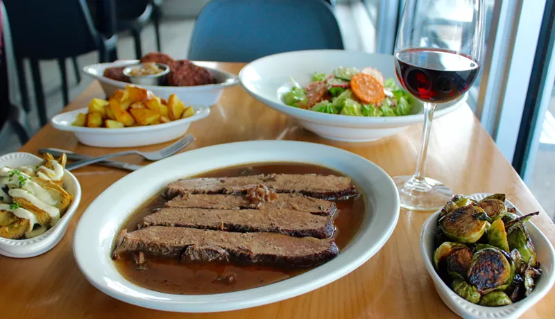Image: Break fast baskets include brisket and one of Blue Collar's signature sides.