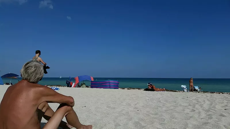 Image: A nudist leader is trying to force the removal of a tiki hut at Haulover Beach because, he says, it attracts a criminal element.