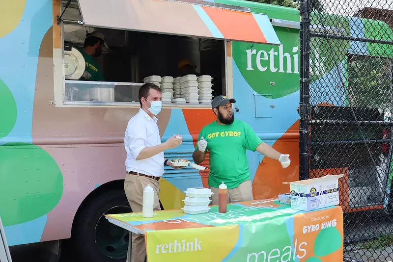 Image: Rethink Food CEO Matt Jozwiak (left) distributes meals with a community organization partner in Brooklyn.