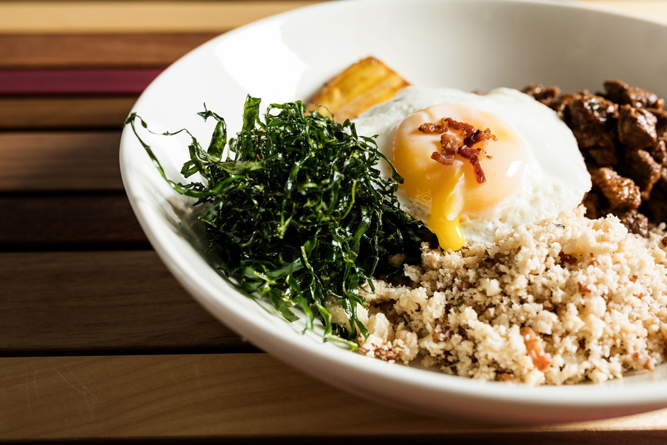 Picadinho with filet mignon, kale, brown rice, farofa, and a fried egg.