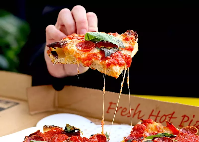 Image: A slice of an Old Greg's Pizza "O.G. Roni" pie