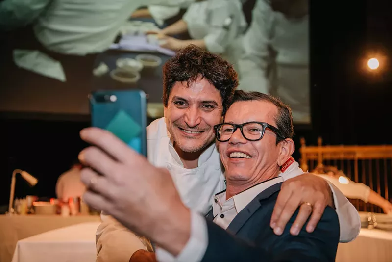 Image: Michelin-starred chef Mauro Colagreco poses with a dinner guest at the 2018 Once Upon a Table event in New York City.