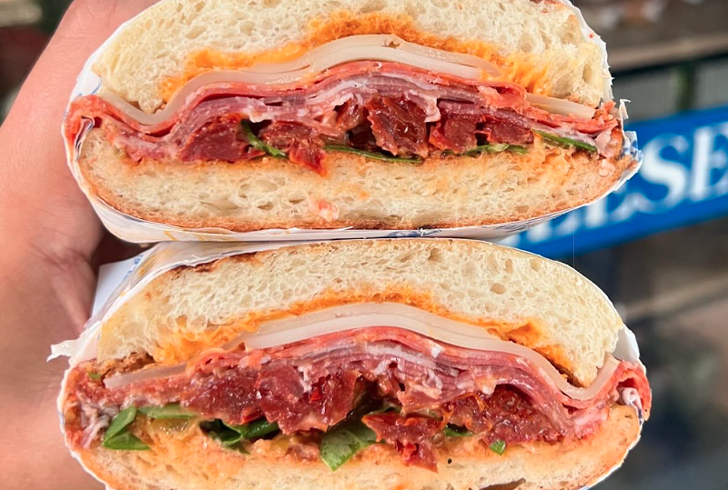 "The Gabagool" made with mezzo doppio bread, hot sorpresatta, capicola, spicy coppa, tomato confit, provolene stagionato, sundried tomato, siracha Japanese mayo, and fresh arugula.