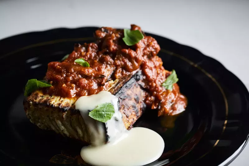 Image: Fire-roasted lasagna with maitake bolognese, Gruyère fondue, and fresh basil. View more photos of Ember here.