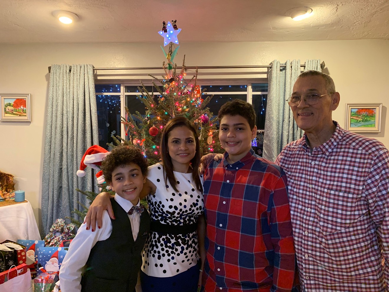 The Inoa family at Christmas: (from left) Adrian, Rosa, Angel, and Roberto