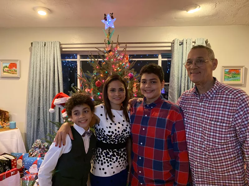 Image: The Inoa family at Christmas: (from left) Adrian, Rosa, Angel, and Roberto