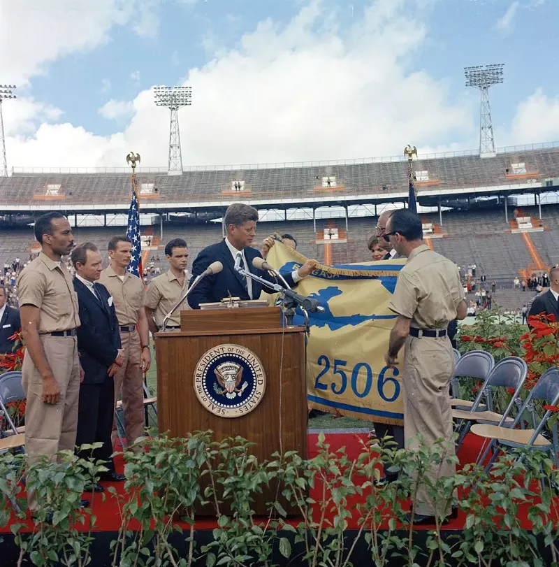 Image: President John F. Kennedy receives the flag of the 2506th Cuban Invasion Brigade at the Orange Bowl Stadium in 1962.