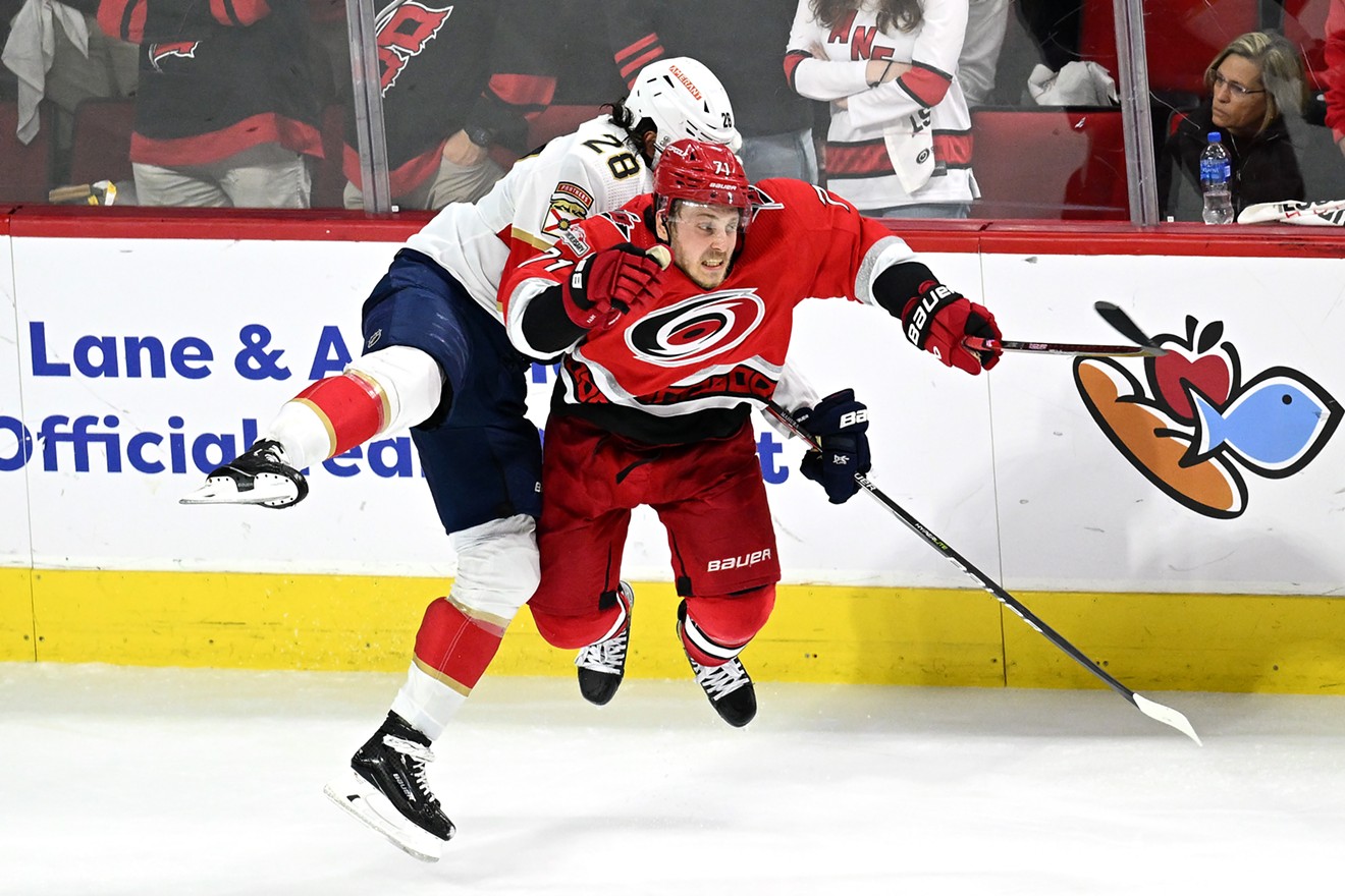 Josh Mahura of the Florida Panthers collides with Jesper Fast of the Carolina Hurricanes during third overtime in Game One of the Eastern Conference Final of the 2023 playoffs on May 18, 2023.