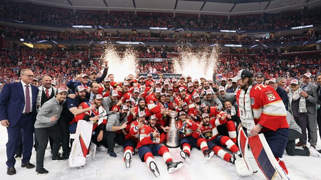 The Florida Panthers gather on the ice to celebrate and pose for a team photo after winning their first championship
