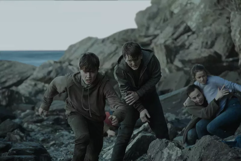 Image: Jonas Strand Gravli (middle) plays Viljar Hanssen, the brother of Torje Hanssen (Isak Bakli Aglen, right), both of whom survived the terrorist attacks that killed 77 people in Norway in 2011 as depicted in 22 July, directed by Paul Greengrass.