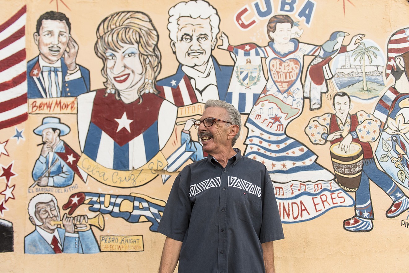 Cruz stands with Cuban music legends Celia Cruz, Beny More, and others in Little Havana.