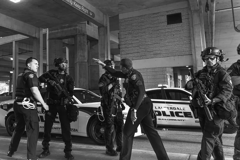 Image: Fort Lauderdale police officer Krystle Smith admonishes fellow officer Steven Pohorence after he pushed a kneeling protester onto the ground during demonstrations on Sunday.