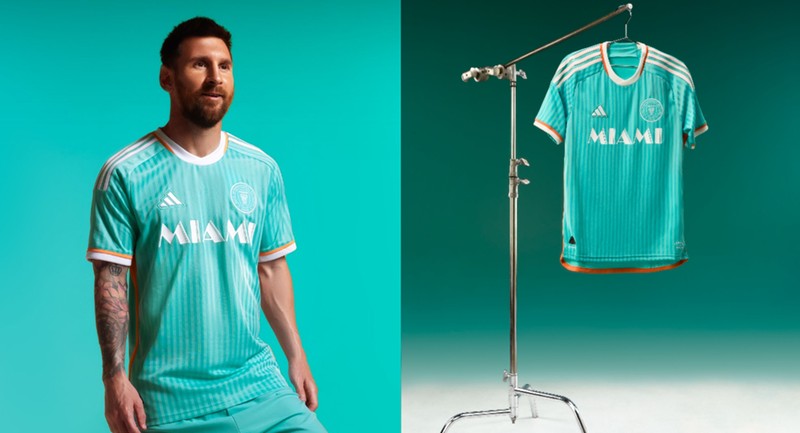 Inter Miami superstar Lionel Messi models the club's new aqua and orange jersey.