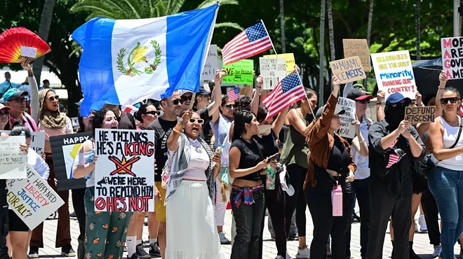 Protesters in Miami rally against President Donald Trump policy decisions.