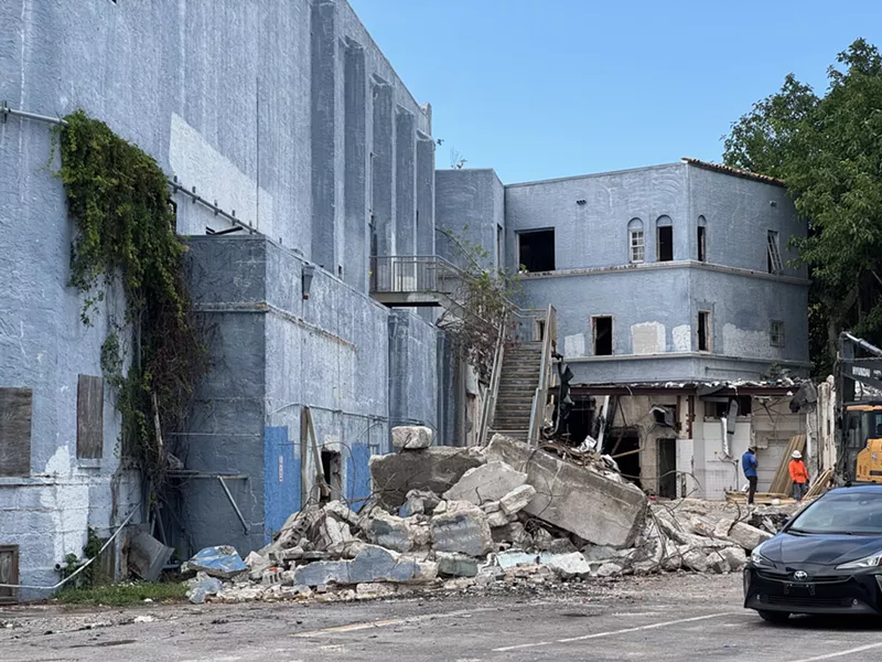 Image: A pile of rubble covers the parking lot at the Coconut Grove Playhouse.