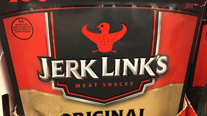 What at first appears to be a Jack Link's original-flavor beef jerky packet is, upon closer inspection, labeled "Jerk Link's Pigeon Jerky," with the Jack Link's stylized longhorn logo replaced by a figure of a dead bird with wings spread to mimic the longhorn horns