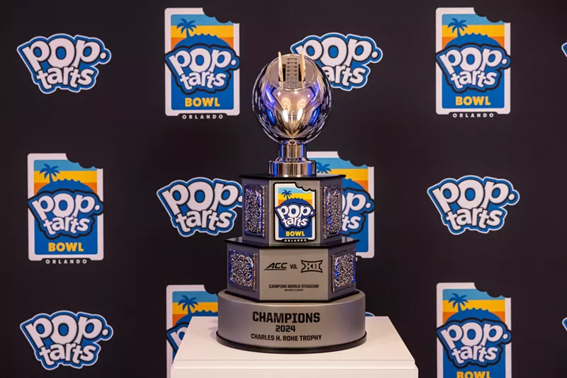 Image: a press room photo of the 2024 Pop-Tarts Bowl trophy, complete with Pop-Tarts