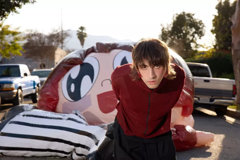 Image: Portrait of Porter Robinson in a red jacket