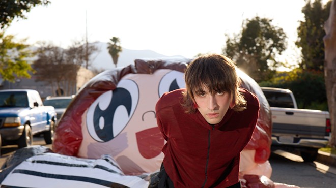 Portrait of Porter Robinson in a red jacket