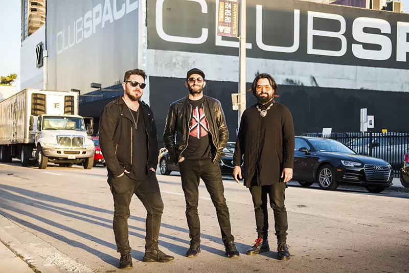 Image: David Sinopoli, Davide Danese, and Coloma Kaboomsky of Club Space standing in the street in front of the venue