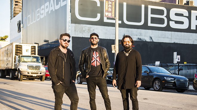 David Sinopoli, Davide Danese, and Coloma Kaboomsky of Club Space standing in the street in front of the venue