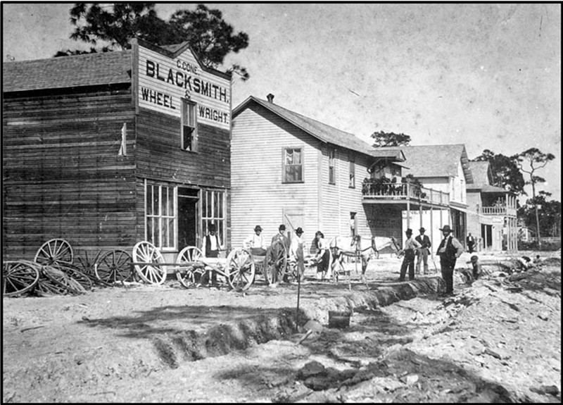 Workers facilitating roadwork on North Miami Avenue in 1896.