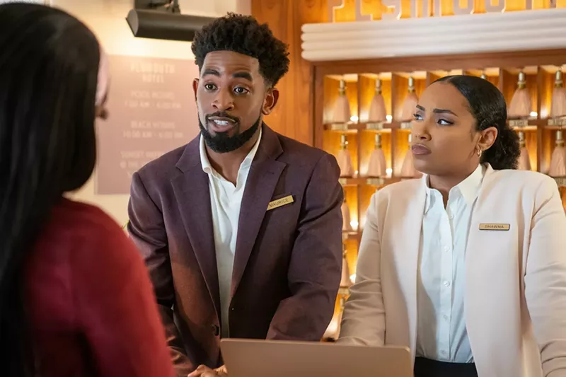 Image: Maurice (Daniel Augustin) and Shawna (Aida Osman) working at the front desk at the Plymouth.