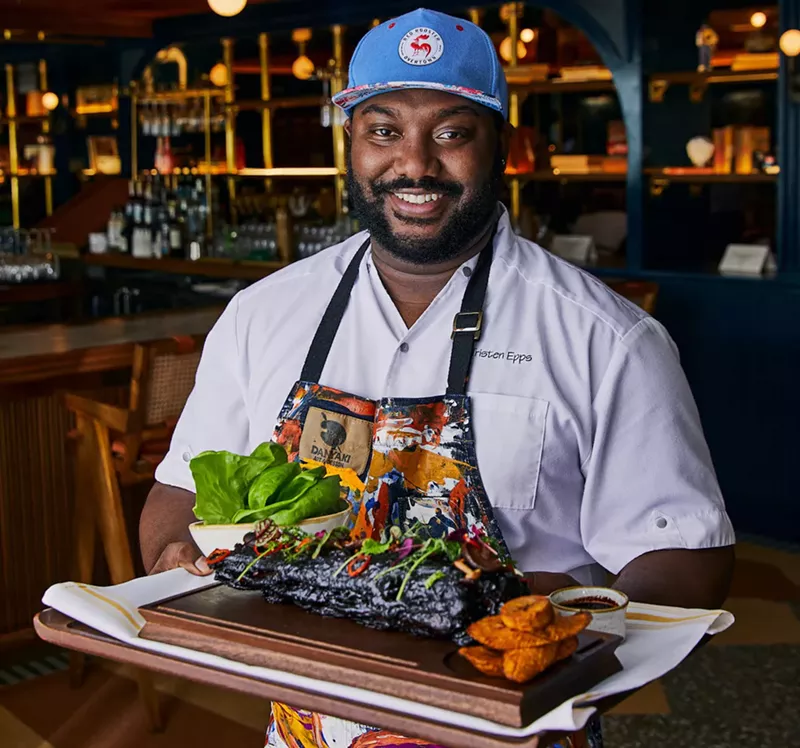 Image: Red Rooster Overtown chef de cuisine Tristen Epps shows off the oxtail.