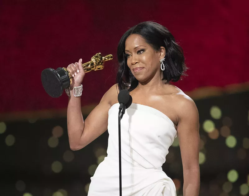 Image: Regina King accepts her Oscar for best supporting actress.