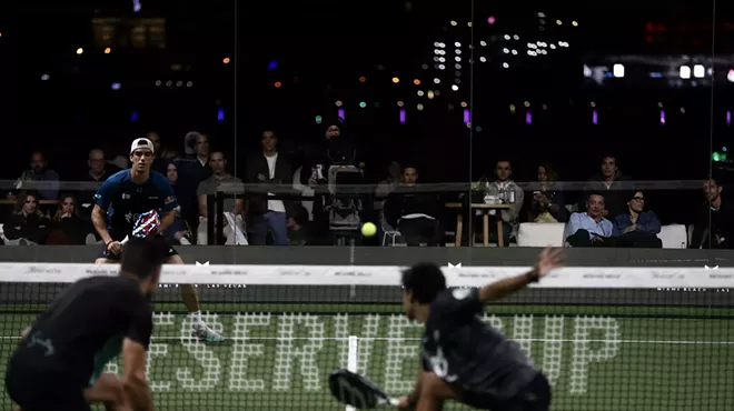 padel players on a court