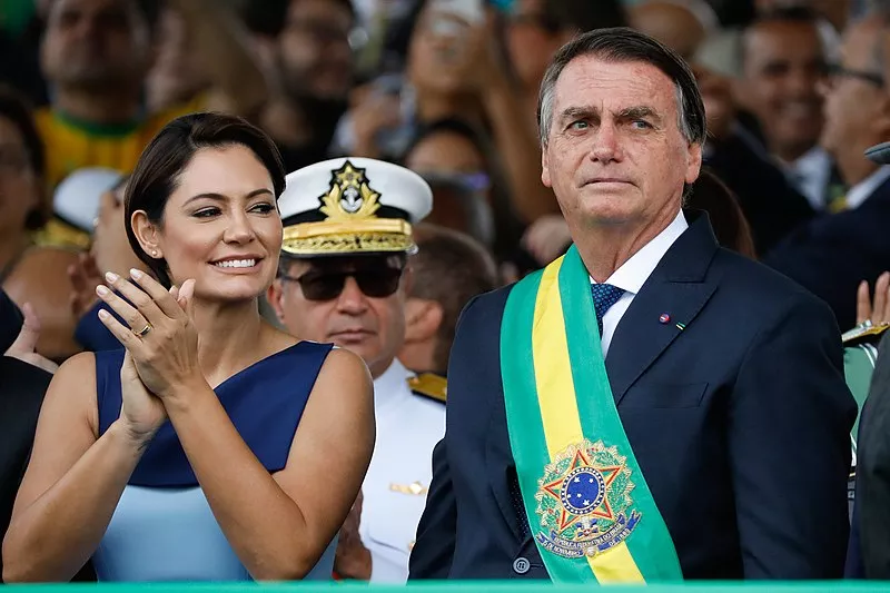 Image: President Jair Bolsonaro attends a military parade alongside his wife, Michelle Bolsonaro, on July 9, 2022.