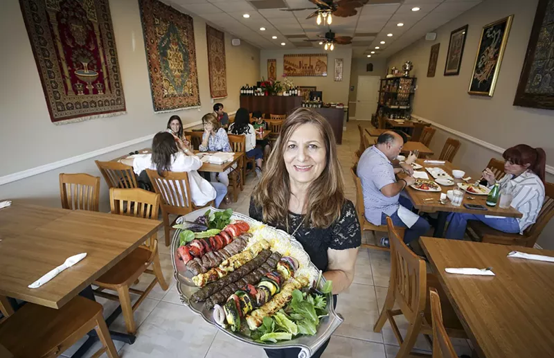 Image: Chef/owner Homa Khakpour holds a platter of tender kebabs.