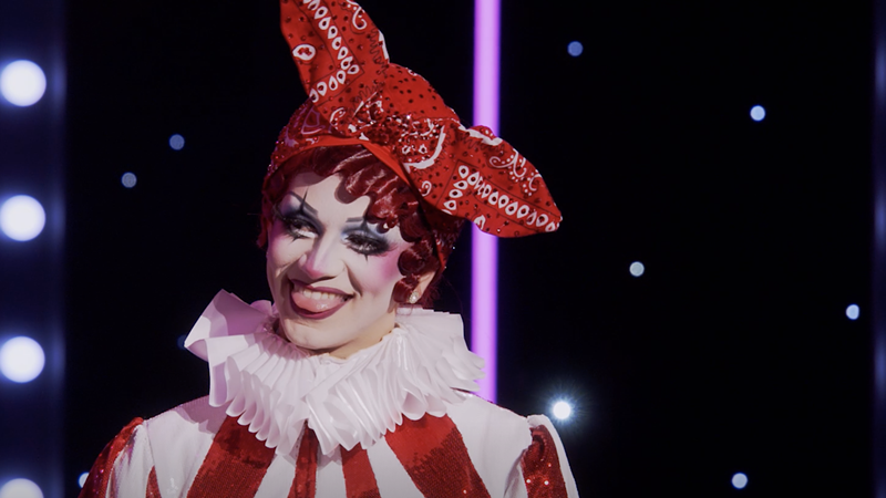 Image: drag queen Suzie Toot dressed in a harlequin outfit