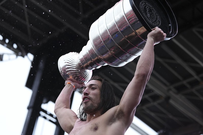 Florida Panthers' Ryan Lomberg hoists the Stanley Cup during the team's victory parade and celebration on June 30, 2024 in Fort Lauderdale, Florida.