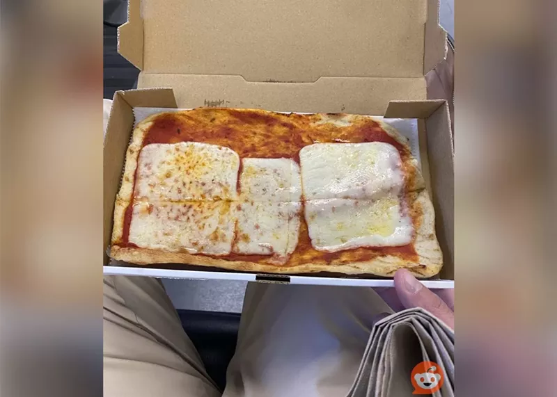 Image: A sad-looking pizza from Miami International Airport has gone viral for its lack of...everything.