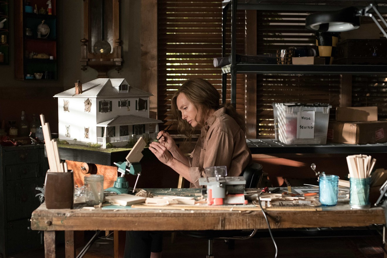 Toni Collette plays Annie, a mother who makes a living as an artist meticulously crafting miniature scenes while drawing inspiration from real-life events, in Ari Aster’s slow-horror film Hereditary.