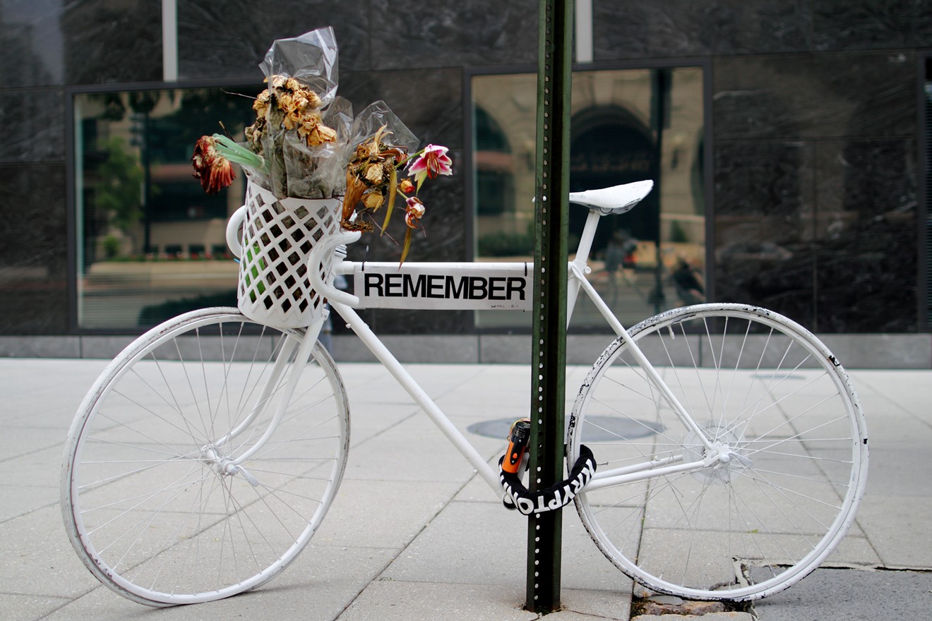 A "ghost bike" memorializes a fallen cyclist.