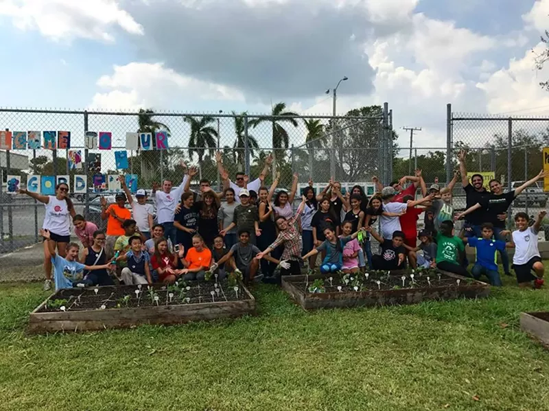 Image: Kids gather to plant a garden with Slow Food Miami.