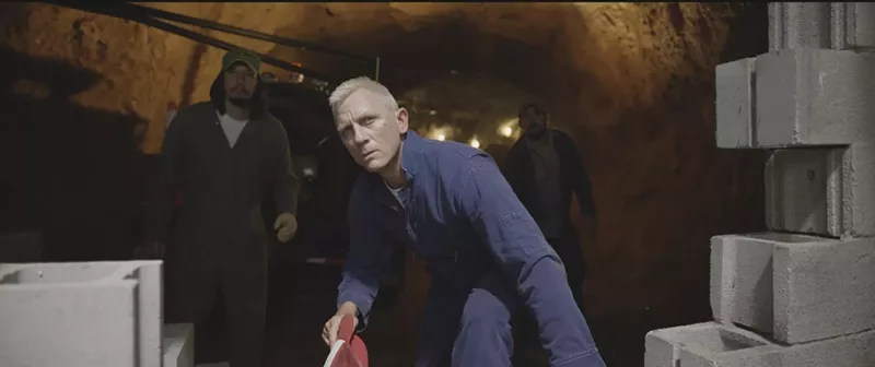 Image: Daniel Craig, in a scene with Adam Driver (left) and Channing Tatum (right), plays Joe Bang, a fast-talking, hootin’ and hollerin’ jailbird, in Steven Soderbergh's Logan Lucky.
