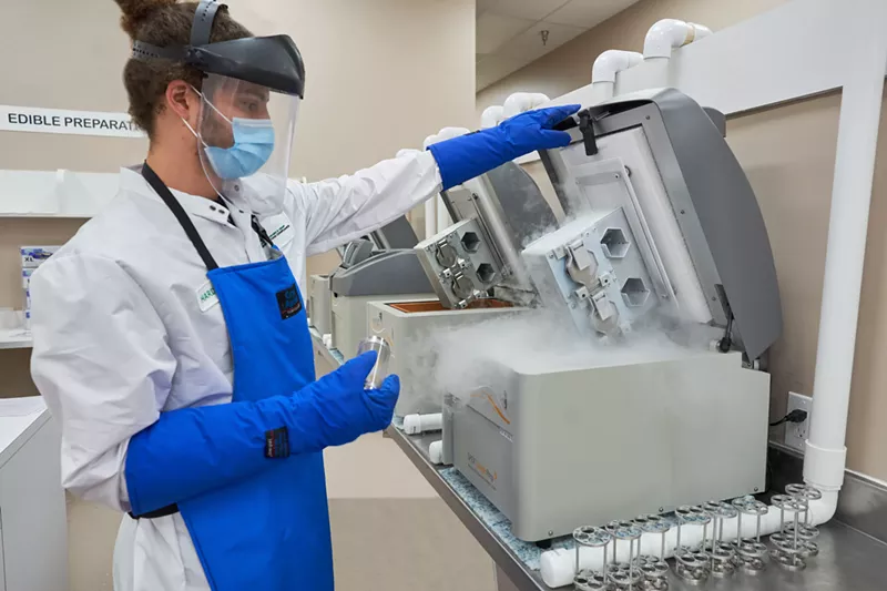 Image: An ACS employee performs tests on marijuana edibles.