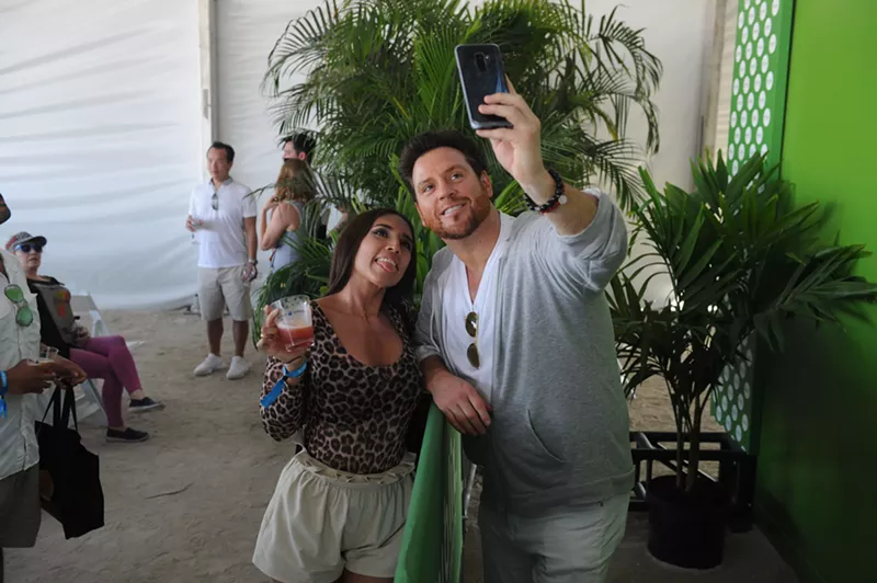 Image: Scott Conant, celebrity chef, restaurateur, and cookbook author, takes a selfie with a fan.