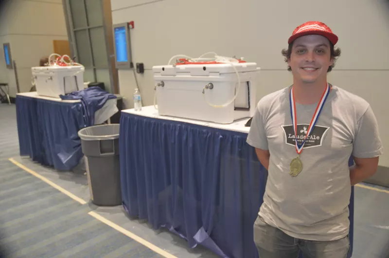 Image: Mike White with the gold medal he accepted on behalf of LauderAle brewery at the Great American Beer Festival in 2017.