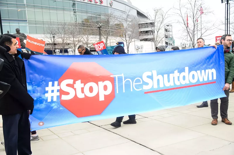 Image: Federal workers protest the government shutdown at Nationals Park.