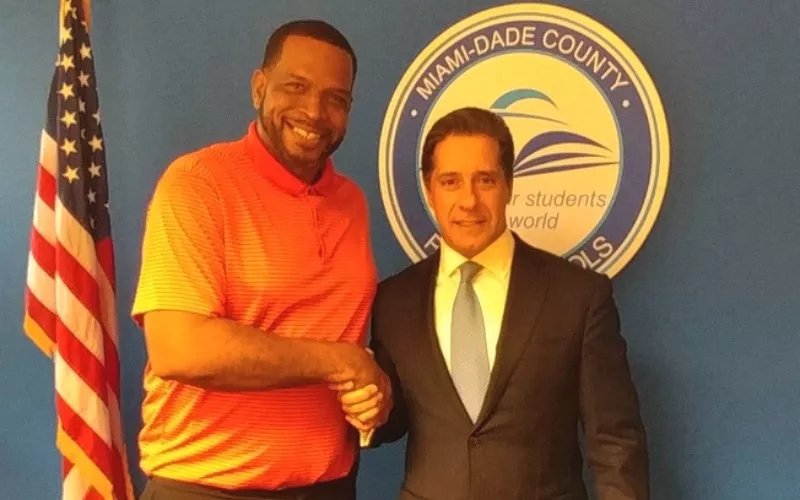 Image: Miami-Dade Superintendent of Schools Alberto Cavallo with Luther "Uncle Luke" Campbell after making a major donation to Liberty City Optimist and Overtown Optimist.