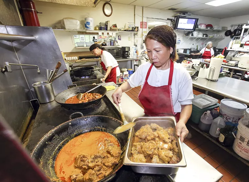 Image: The kitchen is abuzz before the lunch rush.