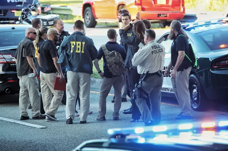 Image: Law enforcement gather near the shooting at Marjory Stoneman Douglas High School. See more photos from the response effort here.