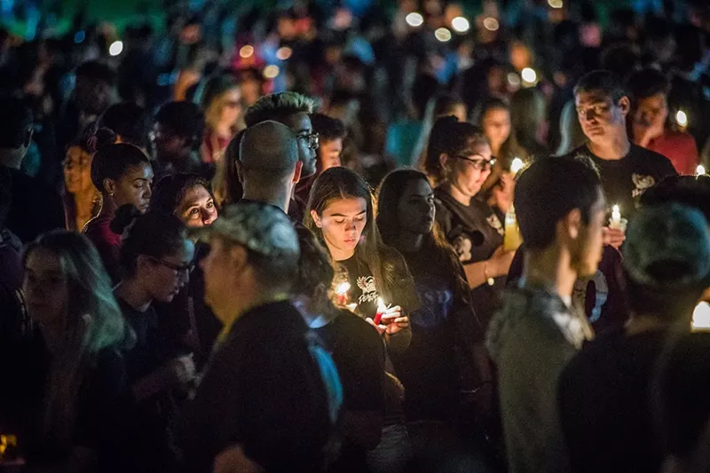 Image: Thousands gathered at Pine Trails Park in Parkland, Florida, to remember the victims of the mass shooting at Marjory Stoneman Douglas High School. See more photos of the vigil here.