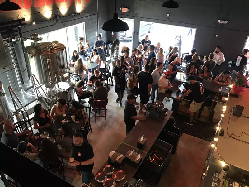 Image: Pizza and beer come together at Strange Beast Brewpub.