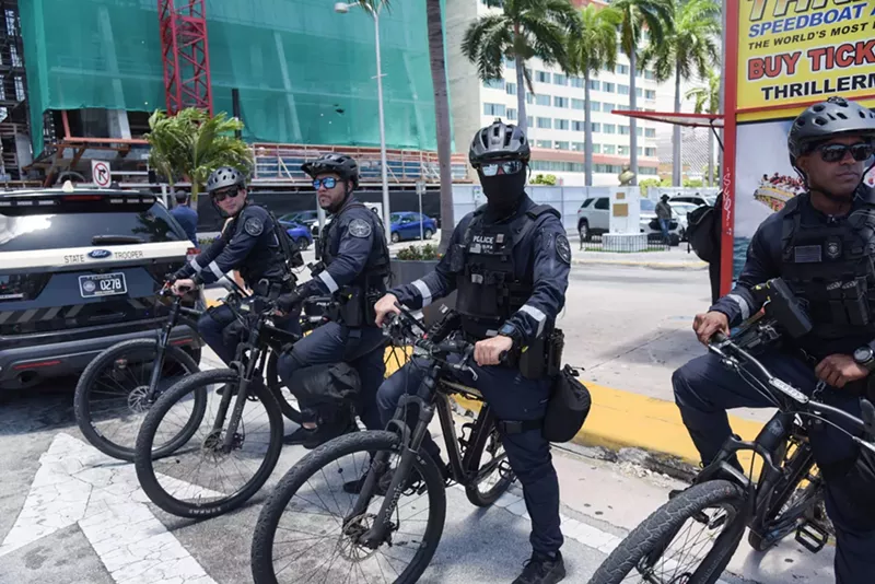 Image: Miami Police Department bicycle officers stand ready at an anti-Trump protest.